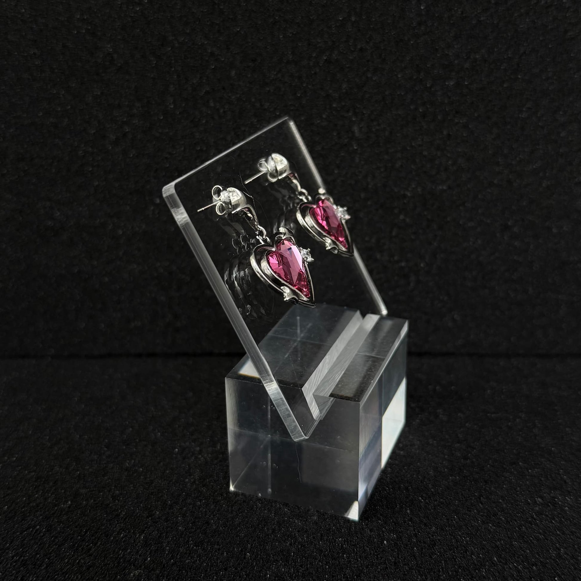 Future Spark Zephyra Heart Earrings, side view, highlighting the unique sculpted profile of the heart shape and the overall structural detail.
