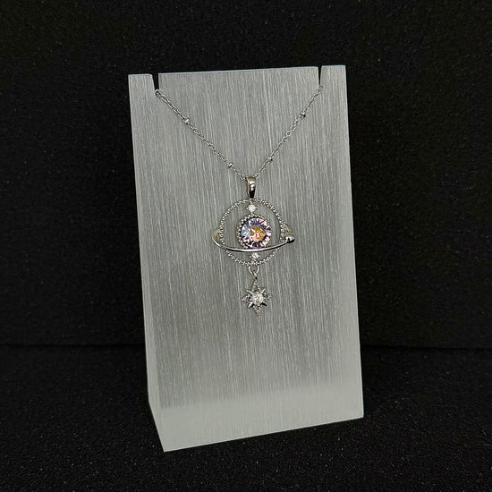 The 'Dimensional Amethyst' variant of Future Spark's Ishtar Planet Pendant, featuring a mesmerizing spherical gemstone that displays a delicate interplay of pink and underlying violet-purple tones, giving it a crystal-like depth and dimension, all within a futuristic silver setting.