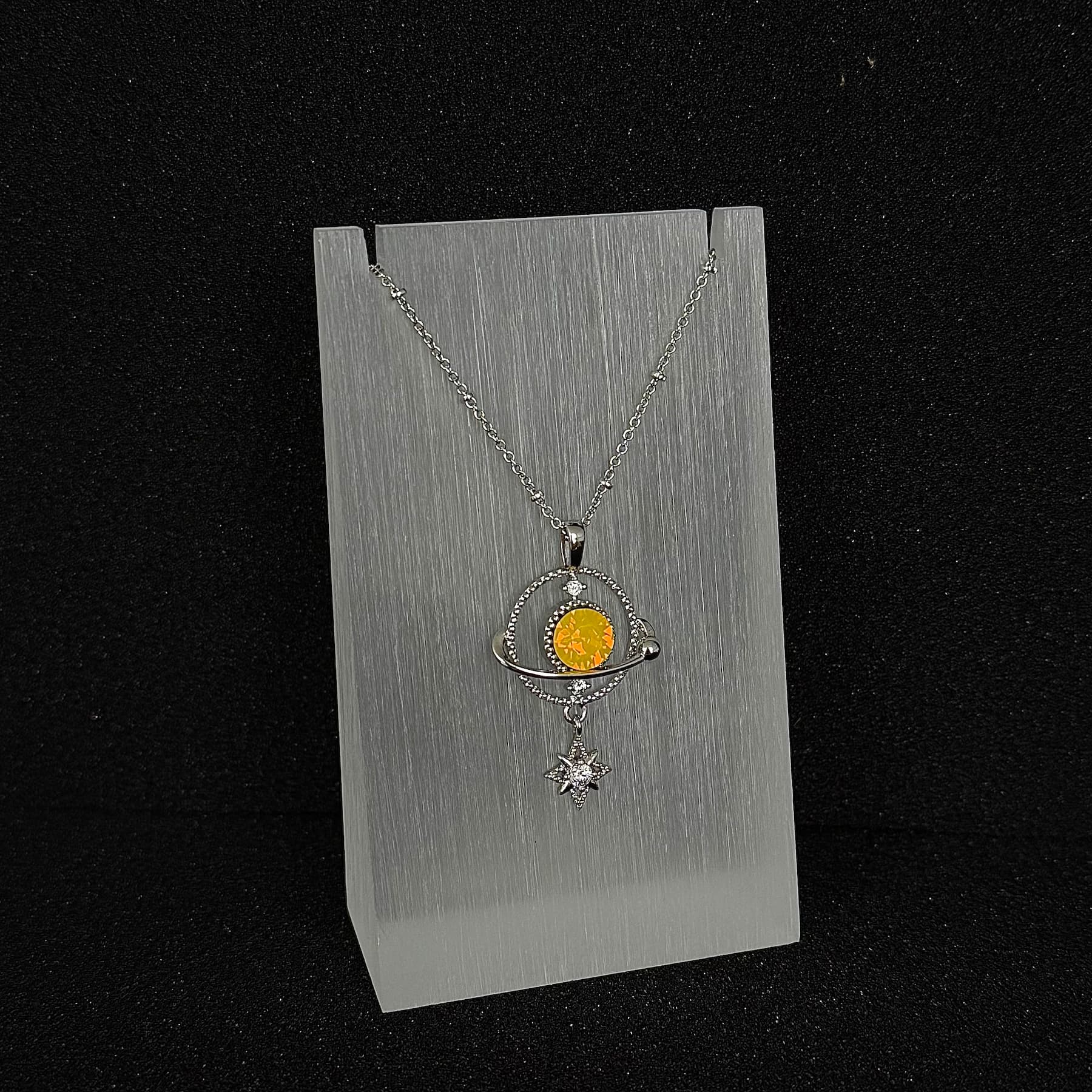 The 'Solar Radiance' variant of Future Spark's Ishtar Planet Pendant, featuring a captivating spherical gemstone that radiates with a powerful, sun-like yellow glow, reminiscent of a celestial flare, all within a futuristic silver design.