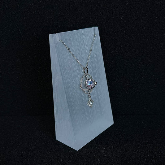 Future Spark Ishtar Planet Necklace, side view, highlighting the unique, futuristic contours of its silver-toned structure and the profile of its signature spherical gemstone.