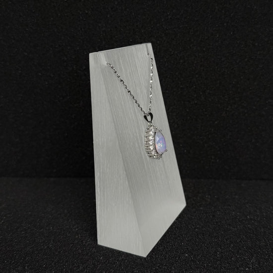 Future Spark's Nyra Teardrop Starburst Necklace, side profile, highlighting the multi-dimensional design of the pendant and its silver-toned finish.
