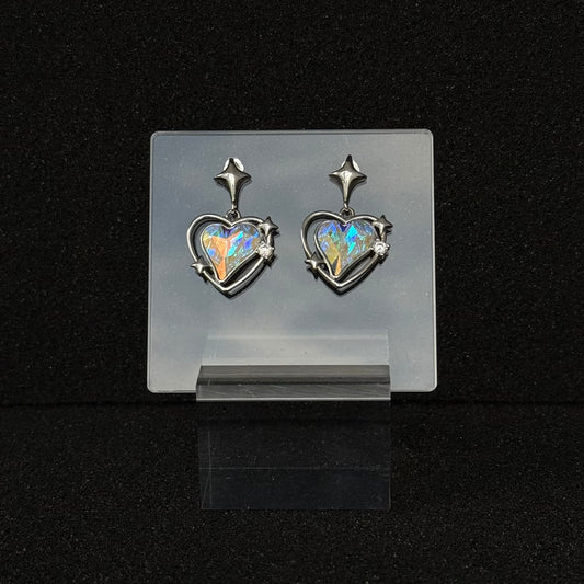 Future Spark Zephyra Heart Earrings in the 'Prism Echo' style, featuring a stunning heart-shaped gemstone that scatters light into an ever-changing rainbow of vibrant hues, like an echoing prism, all set in sleek silver.