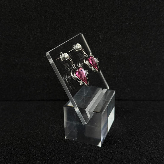 Future Spark Zephyra Heart Earrings, side view, highlighting the unique sculpted profile of the heart shape and the overall structural detail.